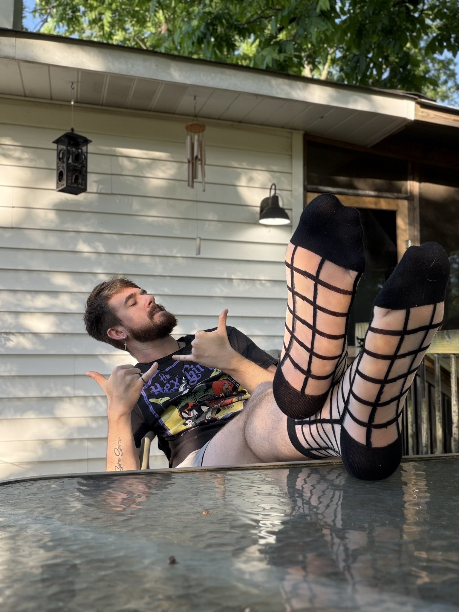 Porch posted. Grids on, skulls out, feet up while you stress about your next bill. I stay relaxed. You stay behind. #findom #sockfin #socklosers #alphasoles #southernalpha #feetuphandsout #porchcontent